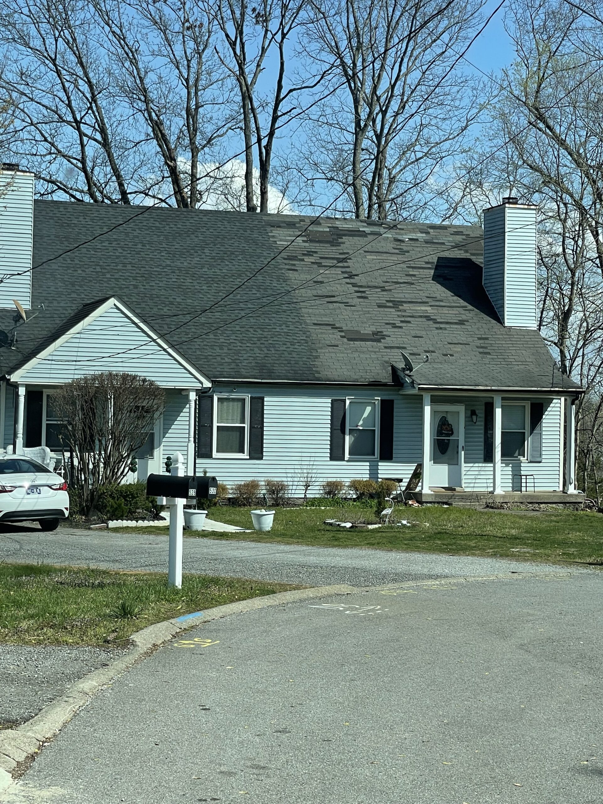 A duplex with Architectural Shingles and 3-Tab Shingles